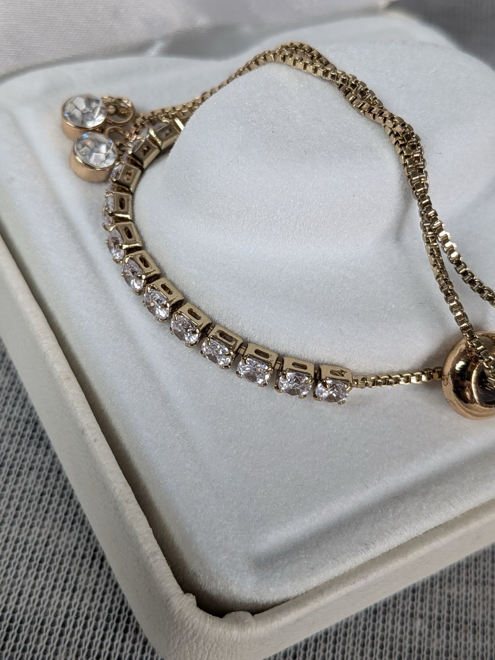 Gold-Tone adjustable tennis style bolo/slider bracelet